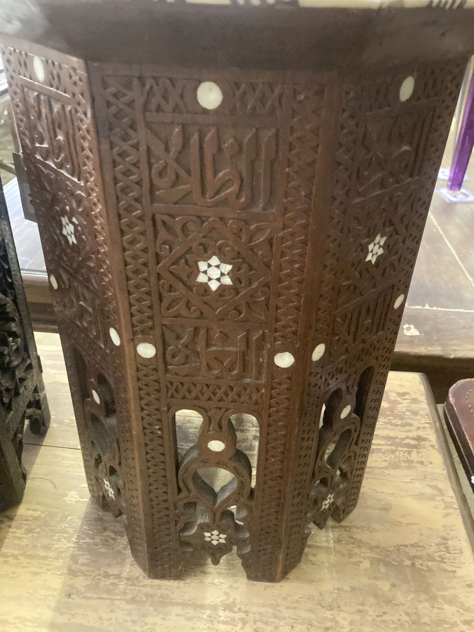 Two Moorish octagonal carved occasional tables, larger width 38cm, height 42cm